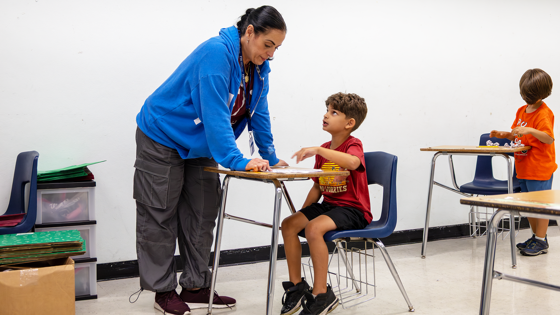 Child in classroom with teacher