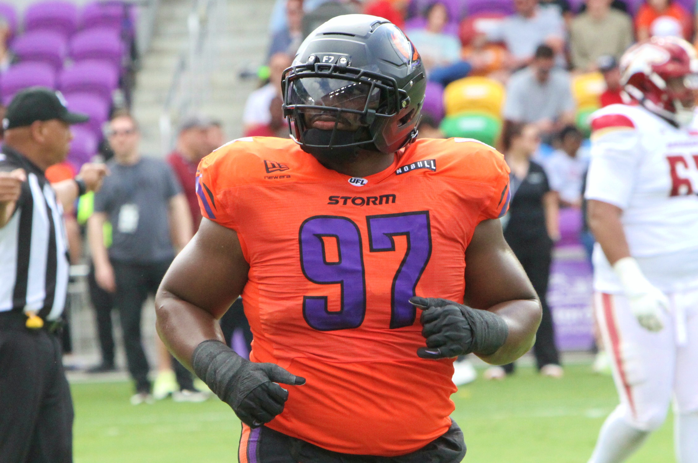 Orlando defensive lineman Isaiah Mack comes off the field during...