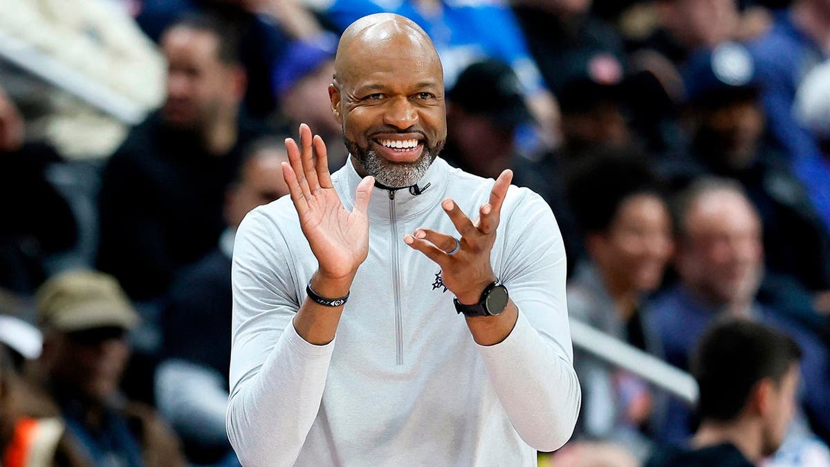 Orlando Magic head coach Jamahl Mosley cheering during NBA playoff game in Detroit