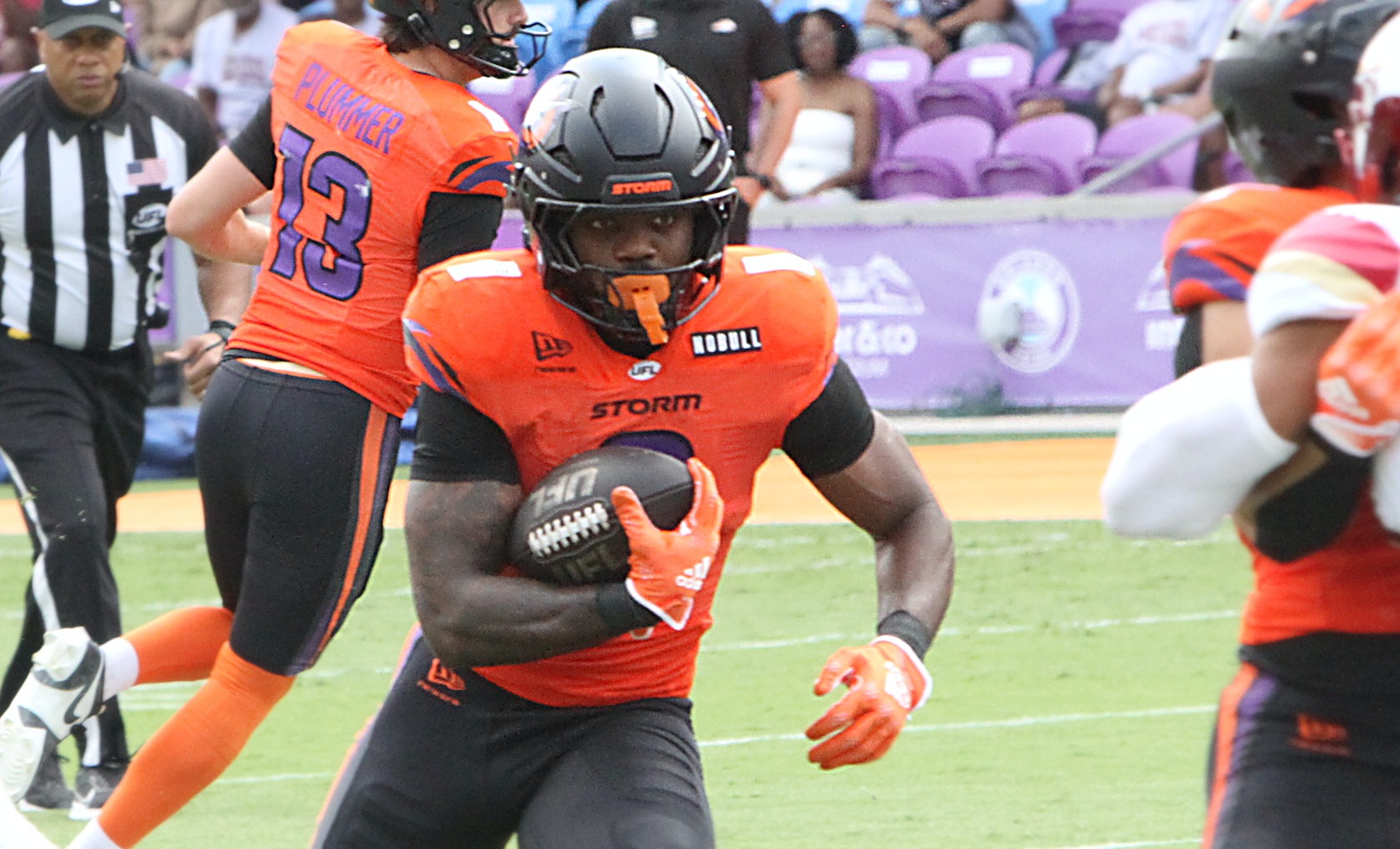 Orlando running back Jashaun Corbin runs for yardage during the...