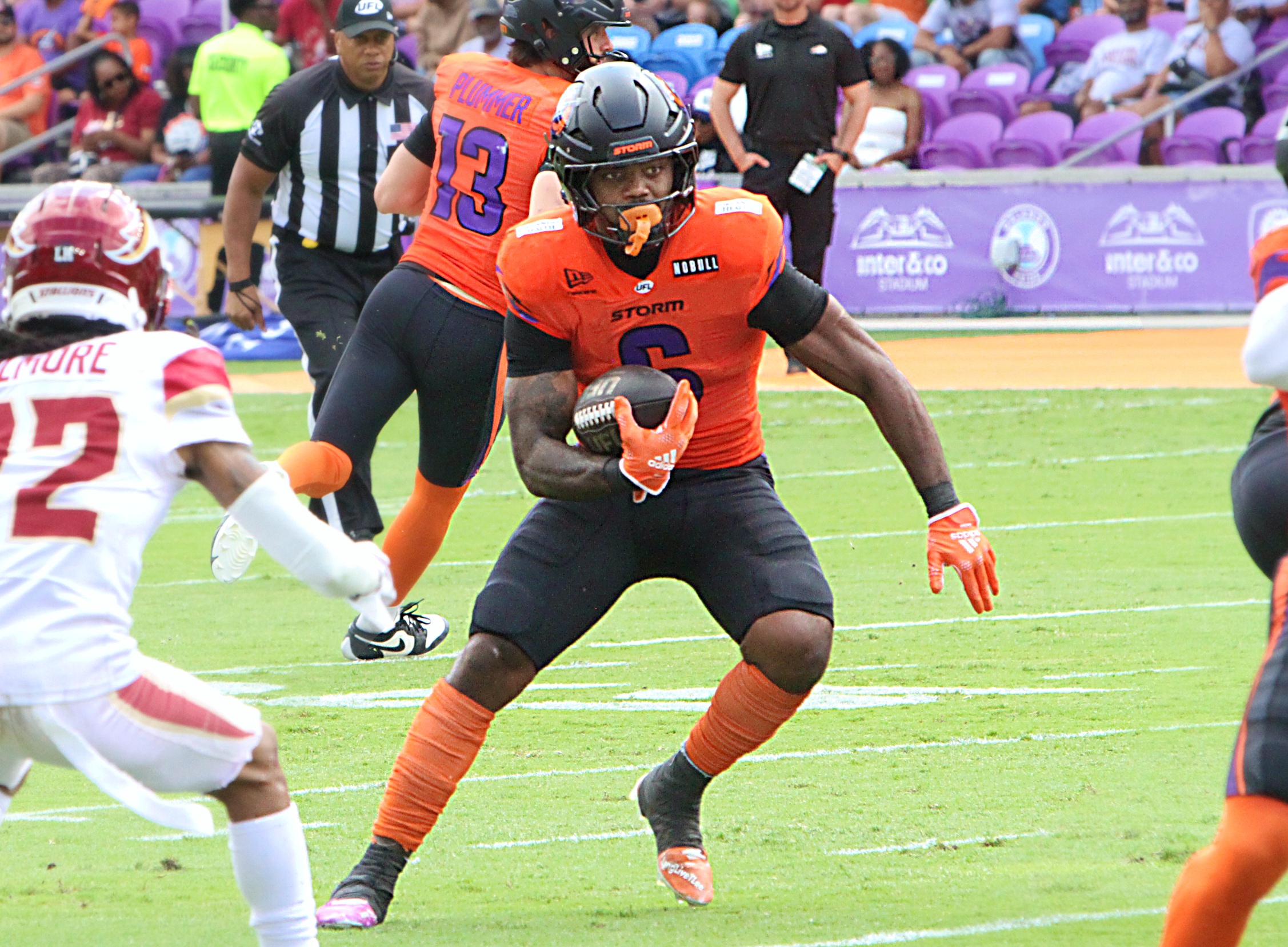 Orlando running back Jashaun Corbin looks for room to run...