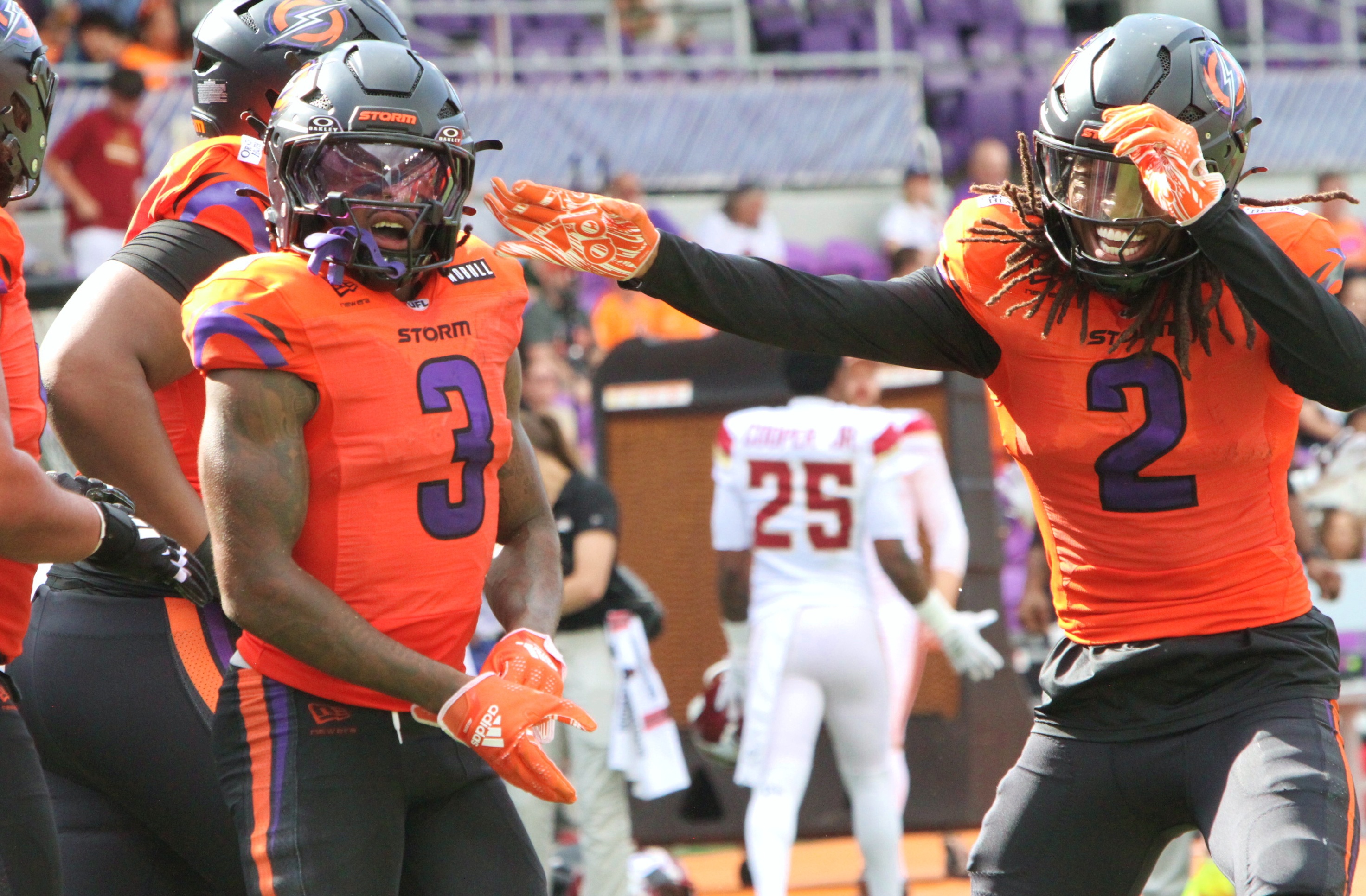 Orlando's Elijhah Badger (2) celebrates a KJ Hamler (3) touchdown...