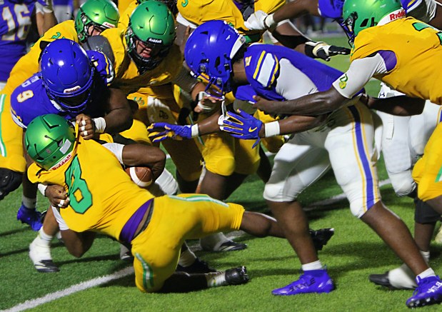 Kyler Priester and the TFA defense made things tough for DeLand in a spring game Friday night, like this tackle on Kaveon Jackson. (Chris Hays/Orlando Sentinel)