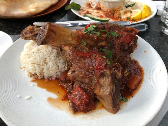 Braised lamb shanks served with rice at Bosphorous Turkish Cuisine