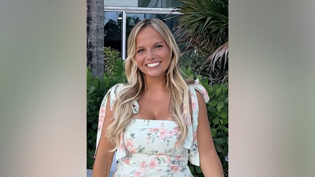 Lauryn Akey standing and smiling outdoors