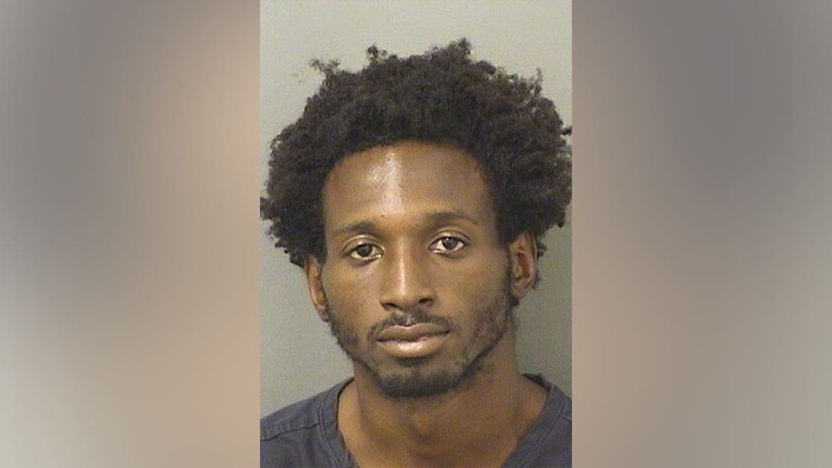 Keo Nottage facing forward in a mugshot photo.