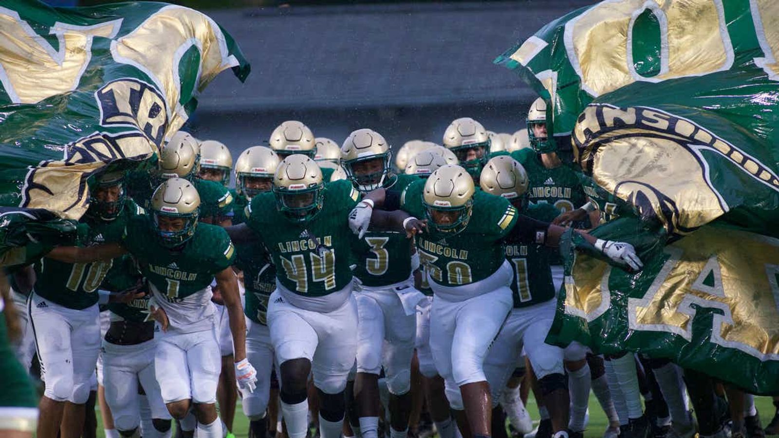 Florida has suspended a high school coach for taking kids on college visit and buying cleats for another