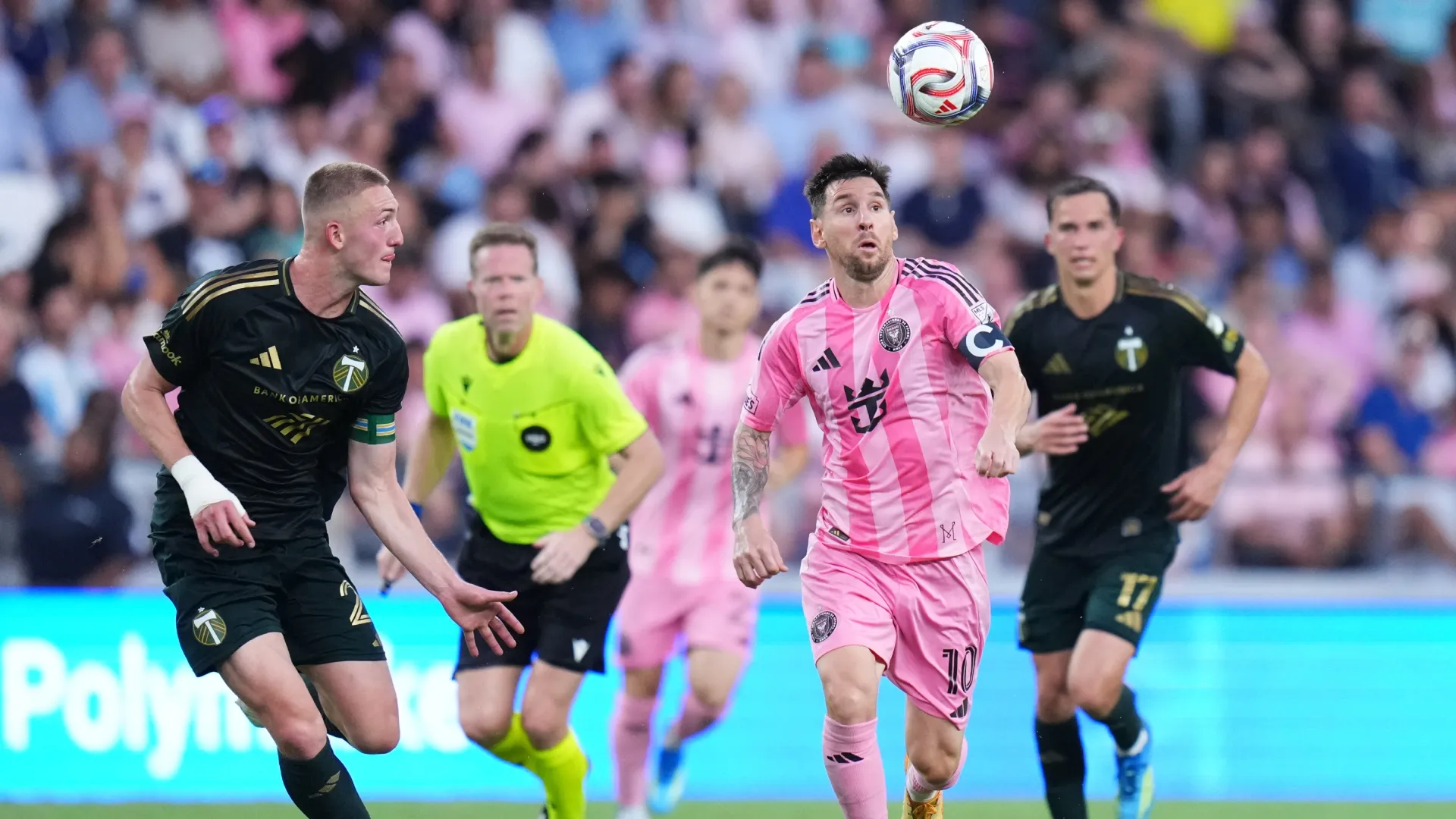 Lionel Messi #10 of Inter Miami CF controls the ball against Finn Surman #20 of the Portland Timbers.