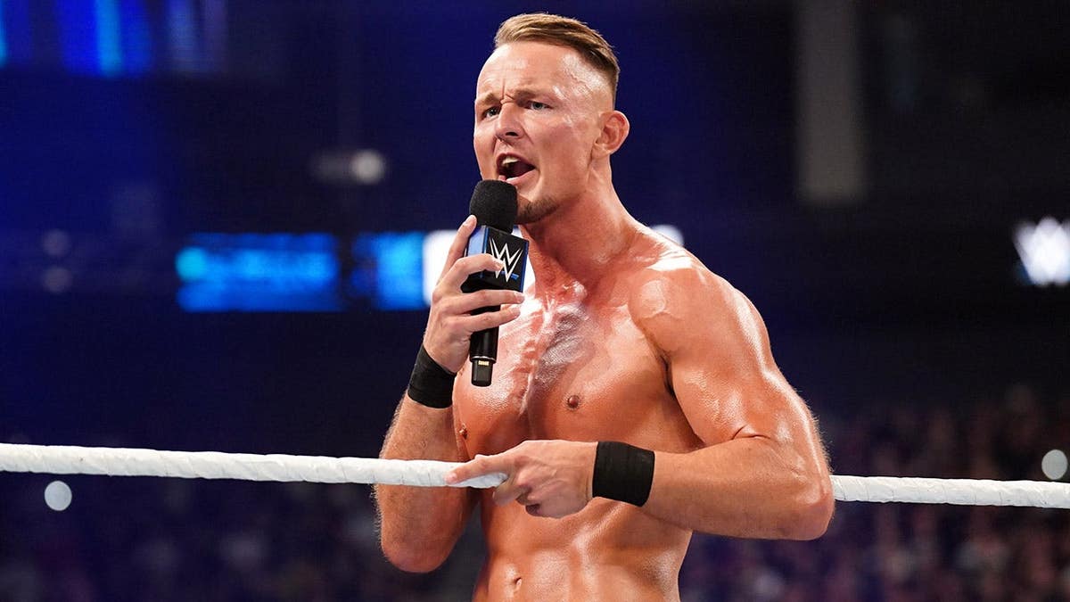 Ludwig Kaiser speaking into a microphone at WWE Friday Night SmackDown in Berlin