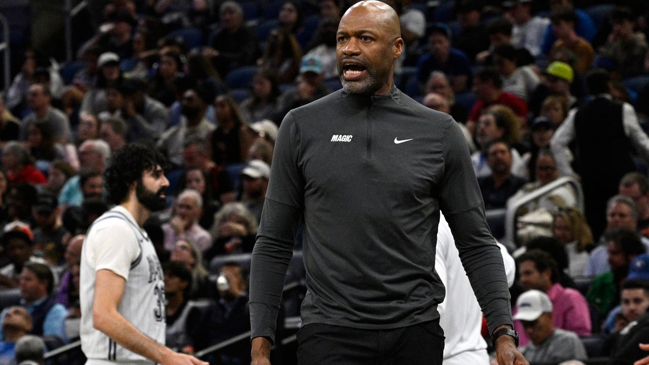 Orlando Magic coach Jamahl Mosley calls out to an official during an NBA basketball game on March 4, 2025. (AP Photo/Phelan M. Ebenhack)