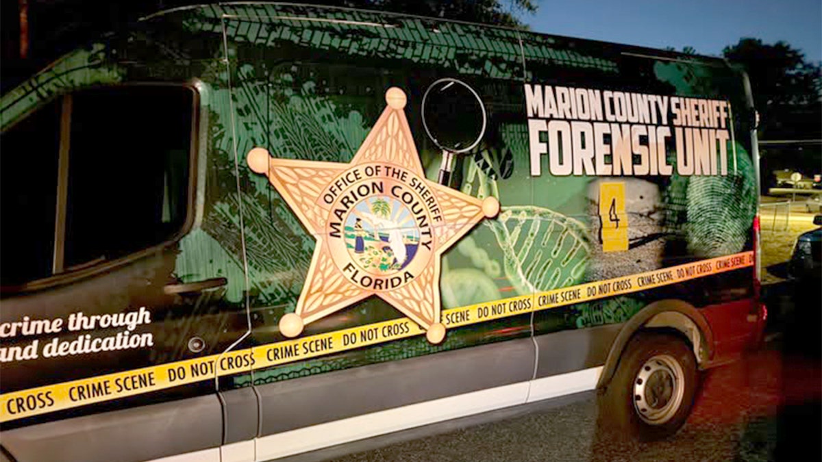 A Marion County Sheriff Forensic Unit van parked at a scene in Florida