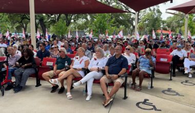 Dozens of people listen to speakers at Veterans Memorial Park in Tampa. (Spectrum News)