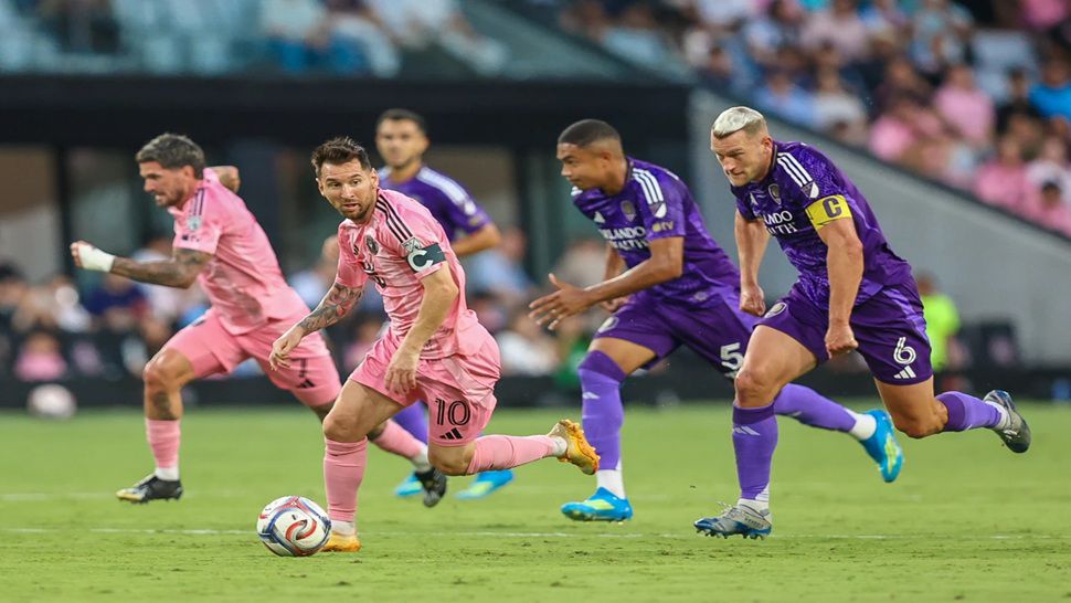 Inter Miami forward Lionel Messi (10) controls the ball as Orlando City defender Robin Jansson (6) attempts to stop in the first half during an MLS soccer match against the Orlando City, Saturday, May 2, 2026, in Miami. (AP Photo/Chris Arjoon)