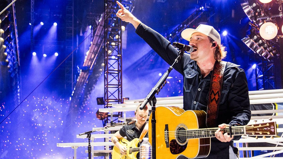 Morgan Wallen performing onstage at Neyland Stadium in Knoxville, Tennessee