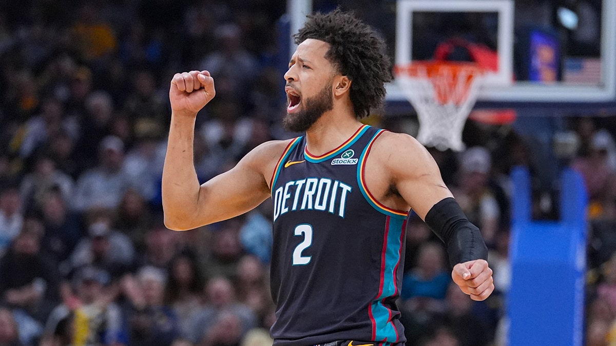 Detroit Pistons guard Cade Cunningham celebrating during an NBA game in Indianapolis