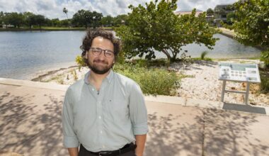 Oliver Laczko standing in front of the living shoreline project he helped create at USF St. Petersburg.