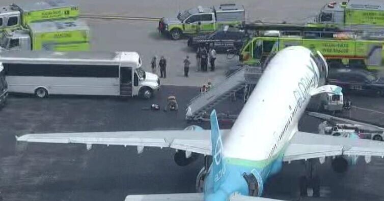 4 passengers hospitalized after being evacuated from plane at Opa-locka airport, Miami-Dade officials say