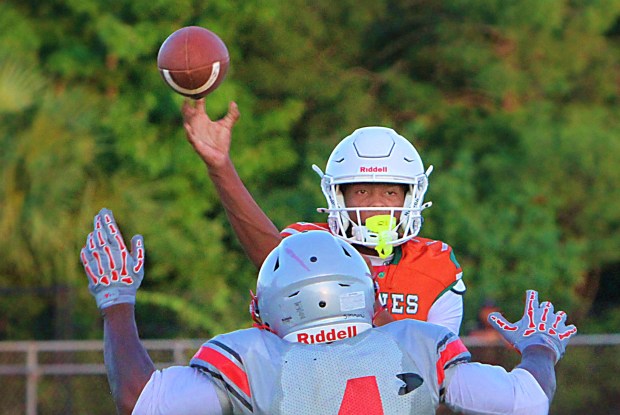 New Jones quarterback Payton Carroll struggled early in a spring game against Lake Mary on Wednesday night, but he rallied in the second half to engineer two scoring drives. (Chris Hays/Orlando Sentinel)