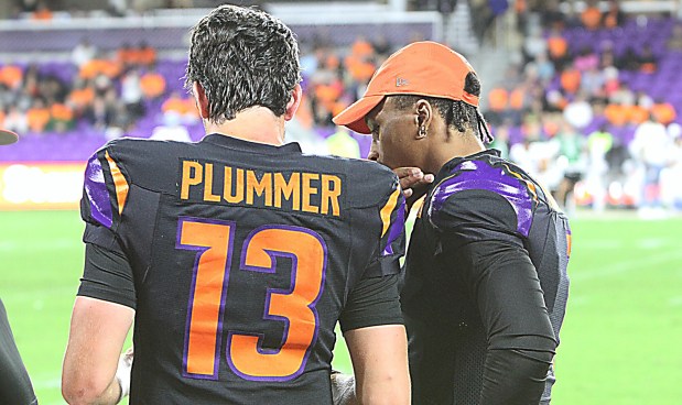 Orlando Storm quarterback Jack Plummer goes over some plays with back-up QB Dorian Thompson-Robinson during the Storm's opening victory against Columbus. Thompson-Robinson was traded to Birmingham two weeks ago and returns to Orlando to face his old team Sunday. (Chris Hays/Orlando Sentinel)
