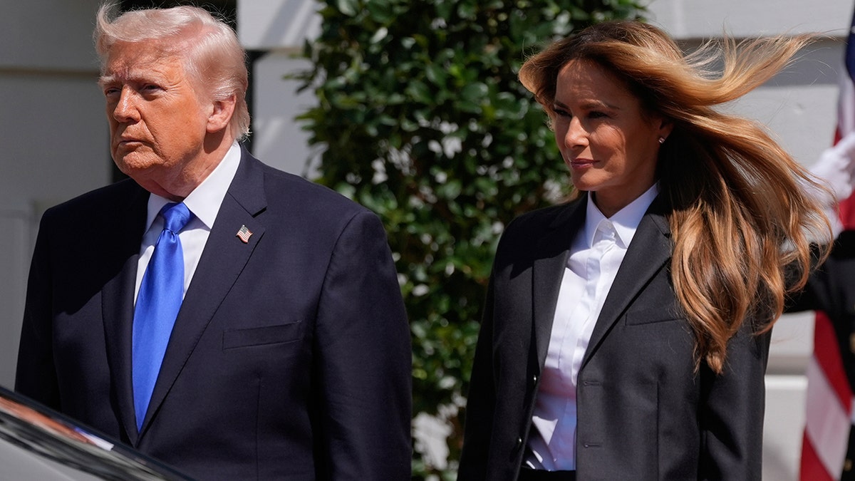 President Donald Trump and first lady Melania Trump walking on the South Lawn of the White House