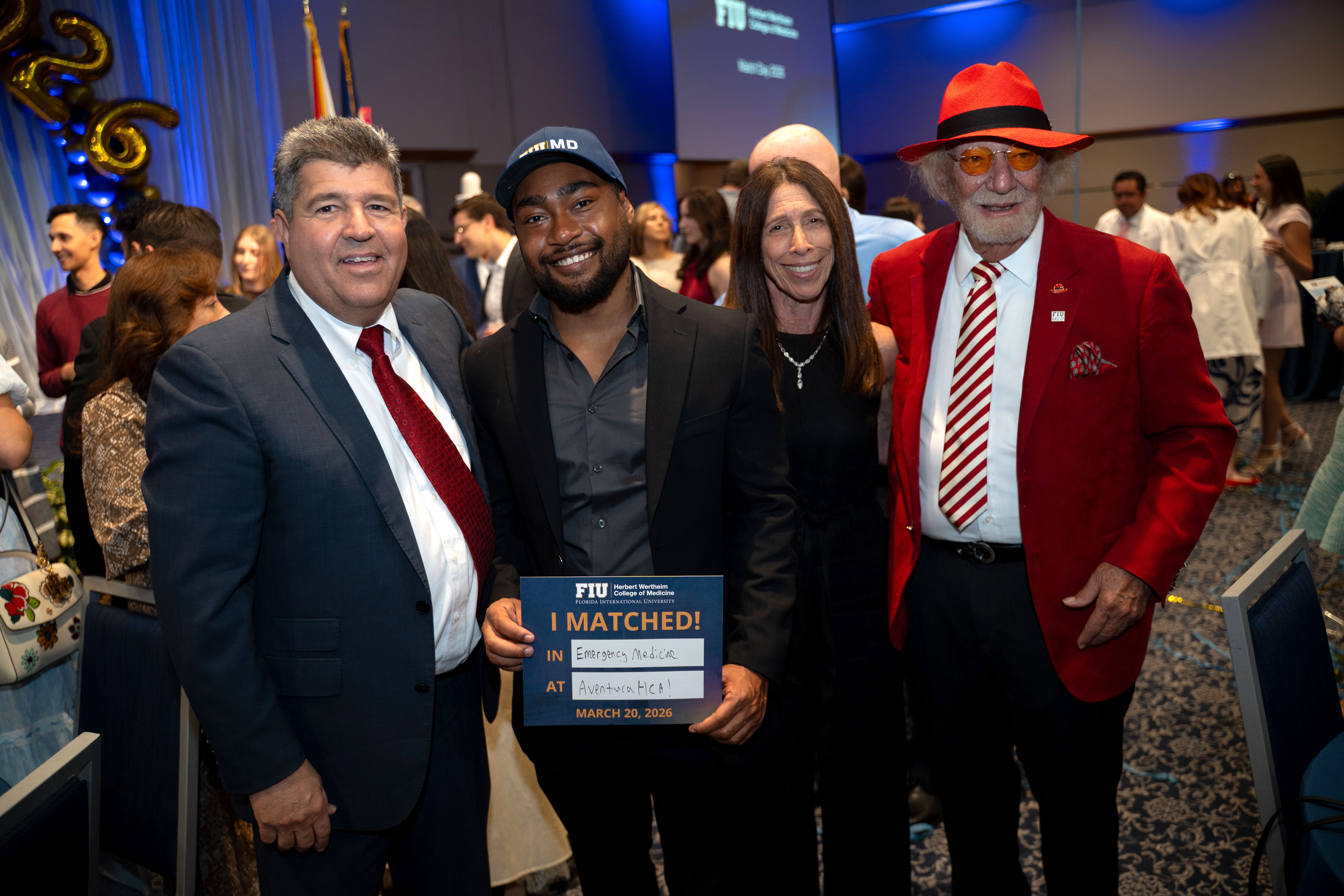 Isa Sabir celebrates Match Day with (from left) Dotson program supporters Dr. Albert and Debbie Taño, and college namesake and scholarship benefactor Dr. Herbert Wertheim.