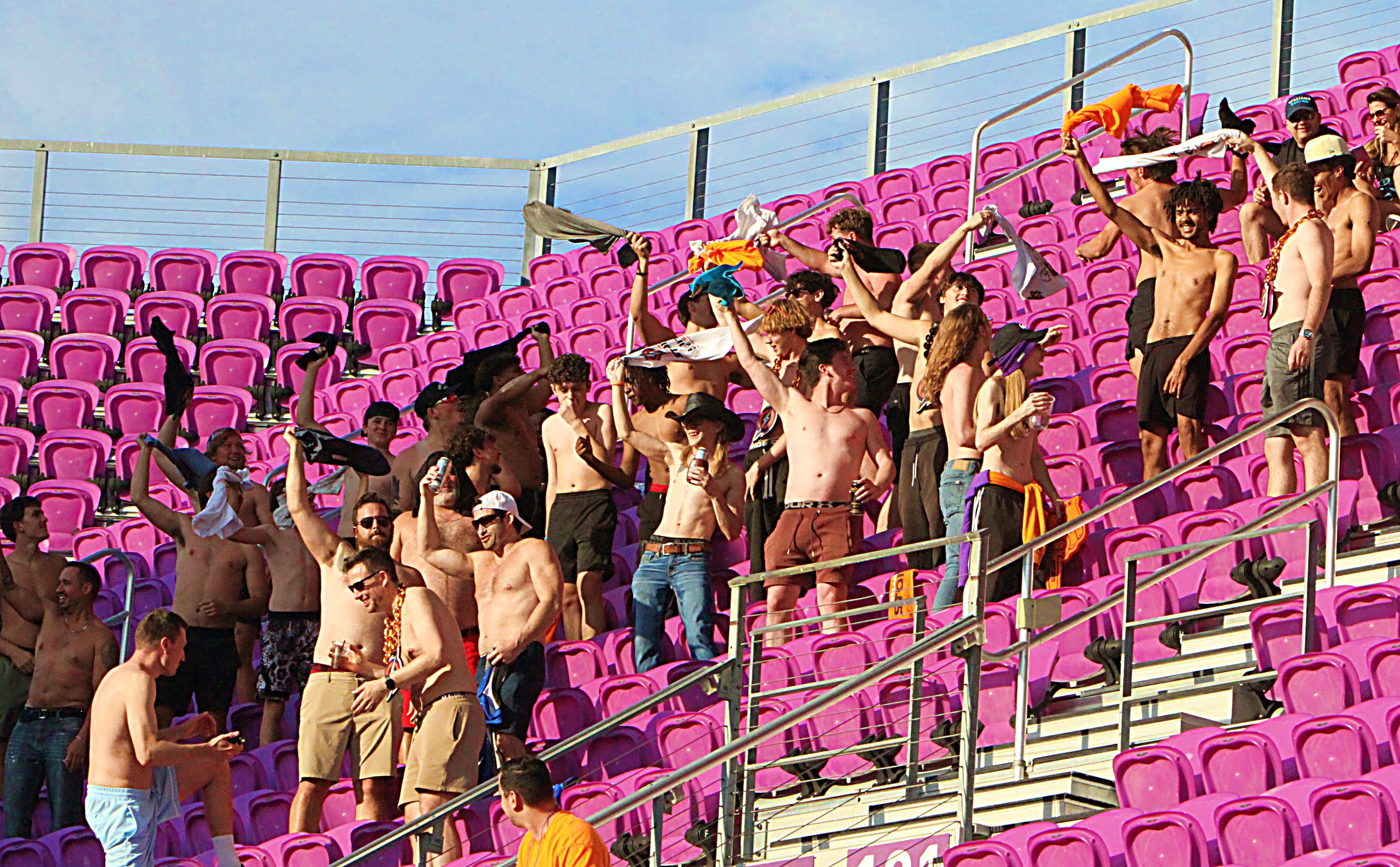 A shirtless group of Orlando Storm fans show their support...