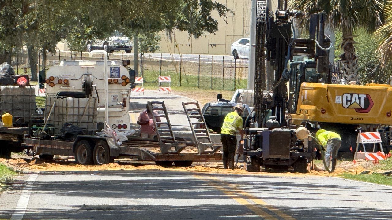 Crews dig holes to check stability of Maitland sinkhole