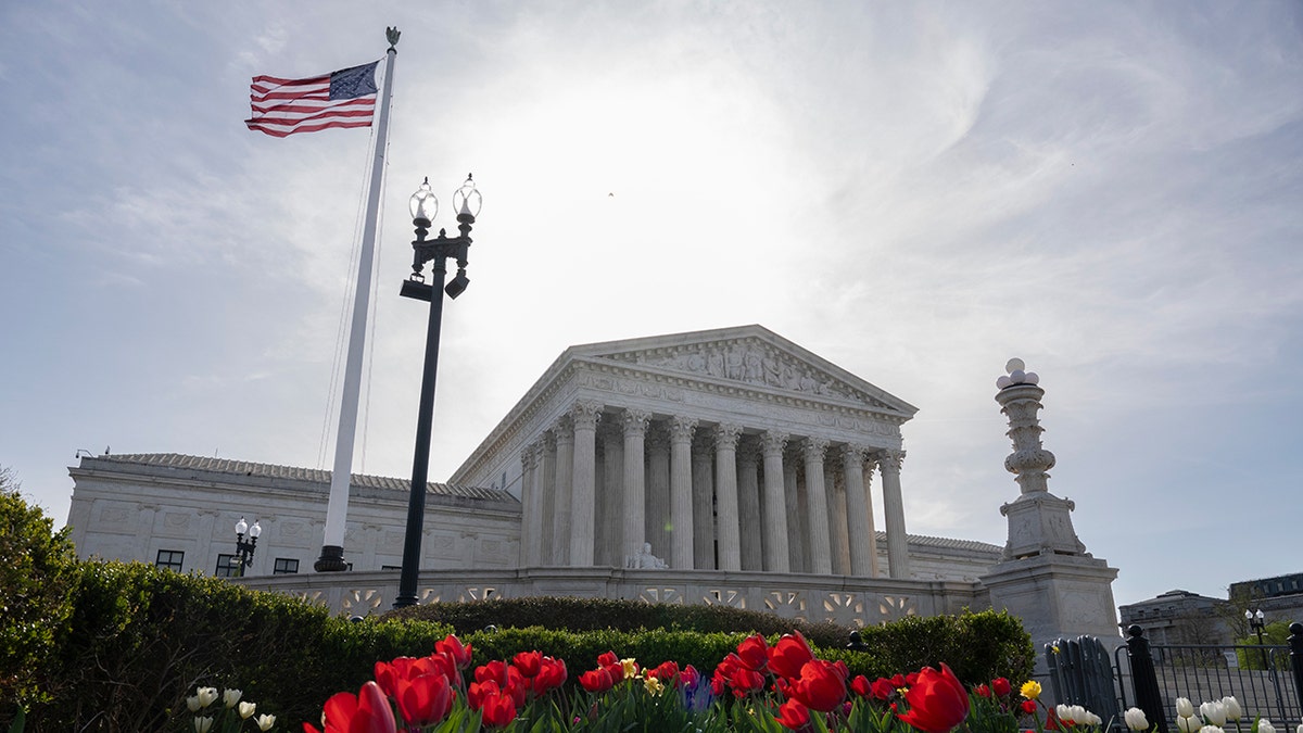 The Supreme Court building in Washington D.C. with flags flying