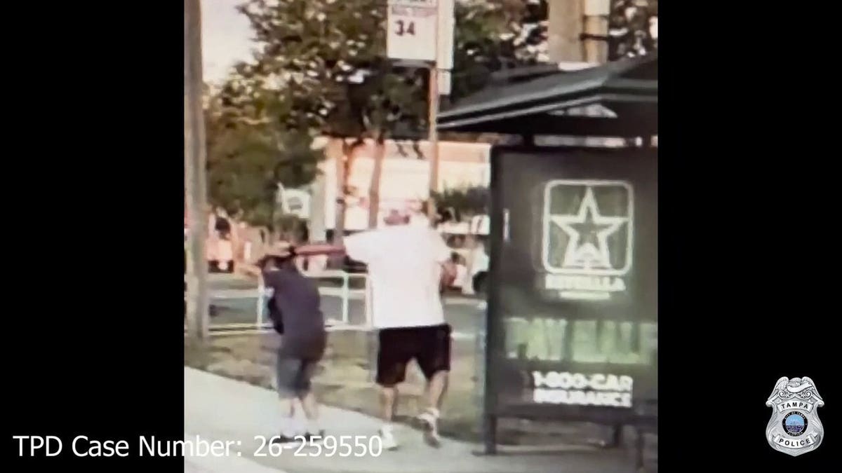 Surveillance footage shows a man approaching a woman near a bus stop in Tampa before an alleged robbery