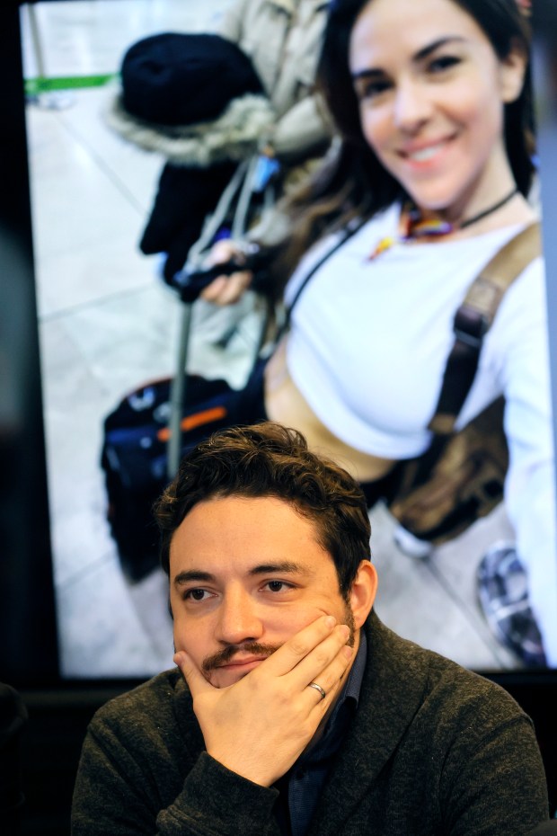 Felipe Henao sits in front of a photo of his sister during a news conference in Fort Lauderdale on Wednesday, May 8, 2024.(Amy Beth Bennett / South Florida Sun Sentinel)