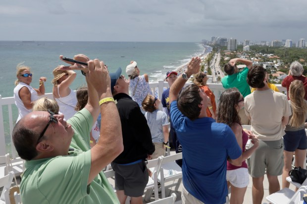 Spectators watch the Fort Lauderdale Air Dot Show Tour from the roof of the Pelican Grand Beach Resort on Saturday May 3, 2025. The show continues on Sunday, May 4, 2025 over Fort Lauderdale Beach. (Mike Stocker/South Florida Sun Sentinel)