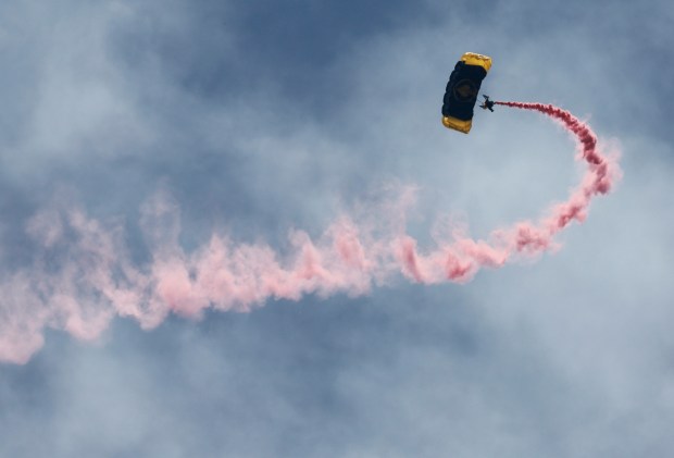 A member of the SOCOM Para-Commandos parachute jump team entertains the crowd on Ft. Lauderdale beach on Saturday May 27, 2023.Crowds gathered for the Memorial Day weekend at the Great American Beach Party, a tradition in the City of Fort Lauderdale.(Mike Stocker/South Florida Sun Sentinel)