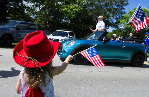 The South Florida Council's Scoutmasters Camporee Committee held its annual Memorial Day Parade and Service in Davie on Monday, honoring fallen military members, veterans and active-duty service personnel. (Scott Luxor/Correspondent)