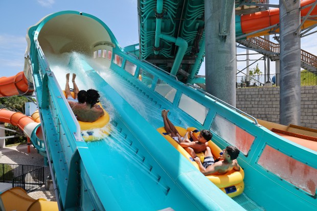 Guests ride the Mega Mayhem at Rapids Water Park in Riviera Beach. South Florida water parks are opening for spring. (Carline Jean/South Florida Sun Sentinel)