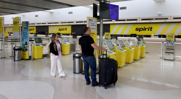 Rosmy Ramirez, along with her cruise partner, had their flight on Spirit Airlines at Fort Lauderdale-Hollywood International Airport canceled Saturday, May 2, 2026. The couple were trying to make their way back home to San Antonio, Texas. (Mike Stocker/South Florida Sun Sentinel)