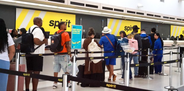 Spirit Airlines customers wait in line at the ticket counter at Fort Lauderdale-Hollywood International Airport in Fort Lauderdale on Friday, May 1, 2026. The airline is preparing for a shutdown after a government bailout failed. (Carline Jean/South Florida Sun Sentinel)
