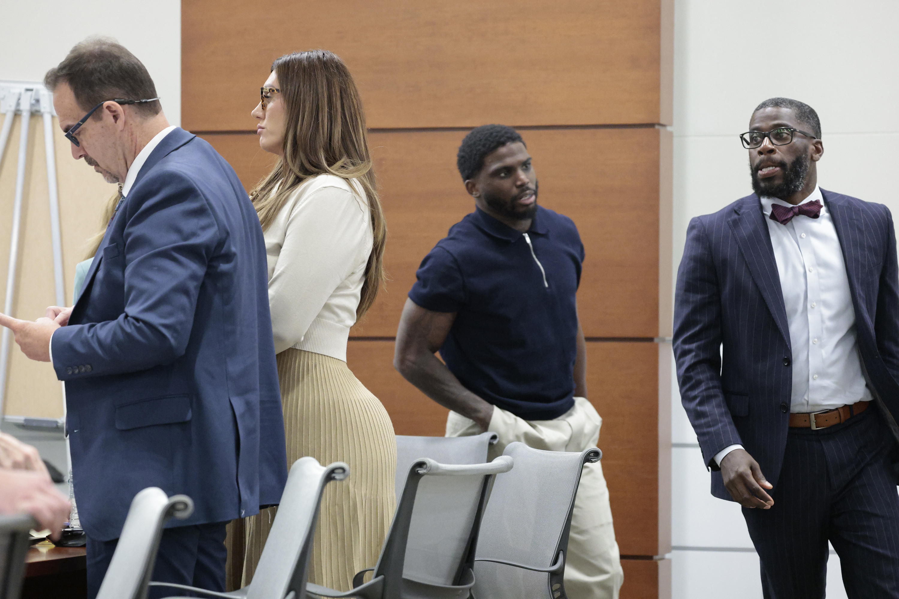 Former Miami Dolphins wide receiver Tyreek Hill passes Sophie Hall,...