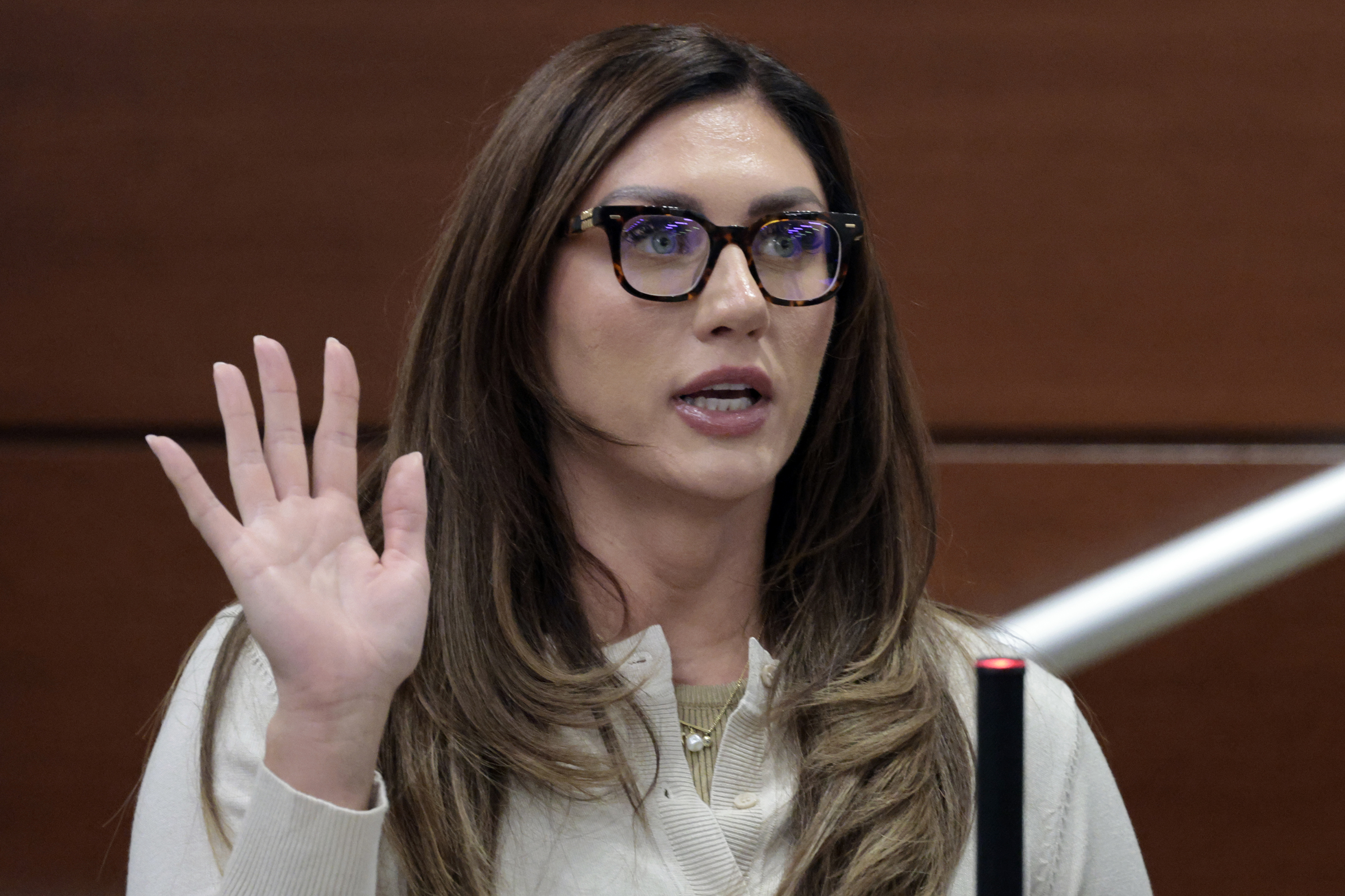 Sophie Hall is sworn in to testify on the first...
