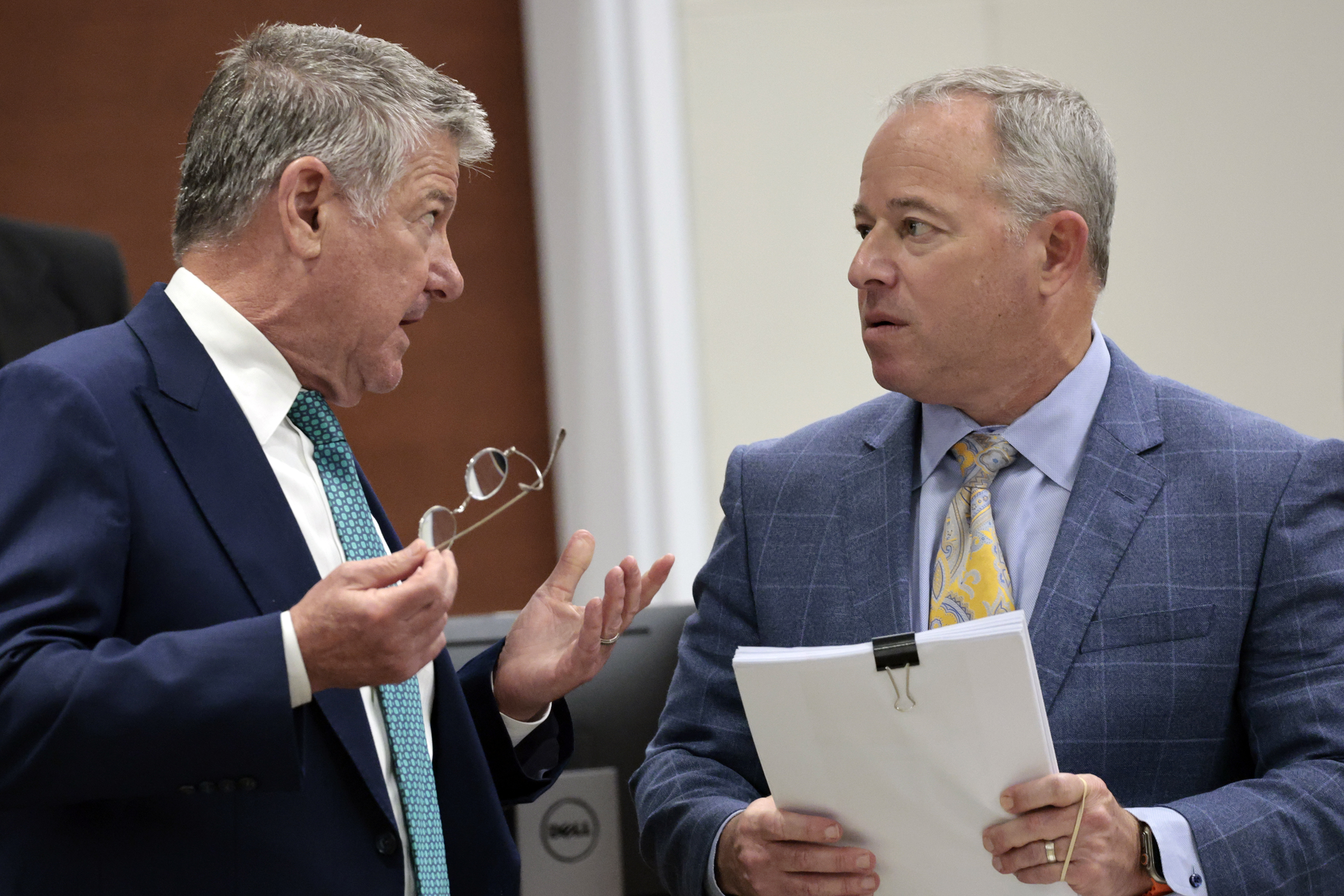Sophie Hallâs attorney, Steven Hammer, left, and former Miami Dolphins...