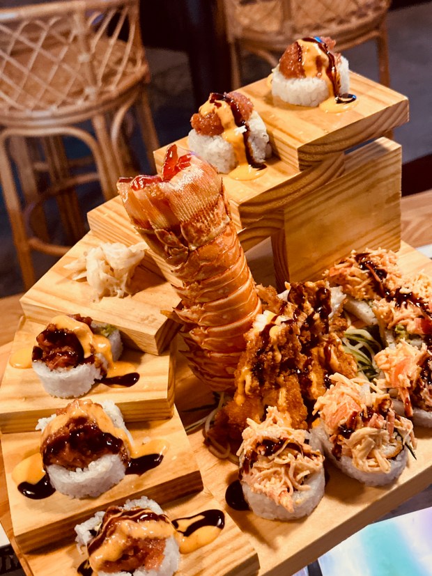One of the dishes with "Miami-style wow presentation" featured on "Drivers, Drive-Ins & Dives" will be the Monster Lobster Roll tower, built with fresh lobster tail, cucumber, avocado, spicy crab and eel sauce. (Kris Limpanuwat / Courtesy)