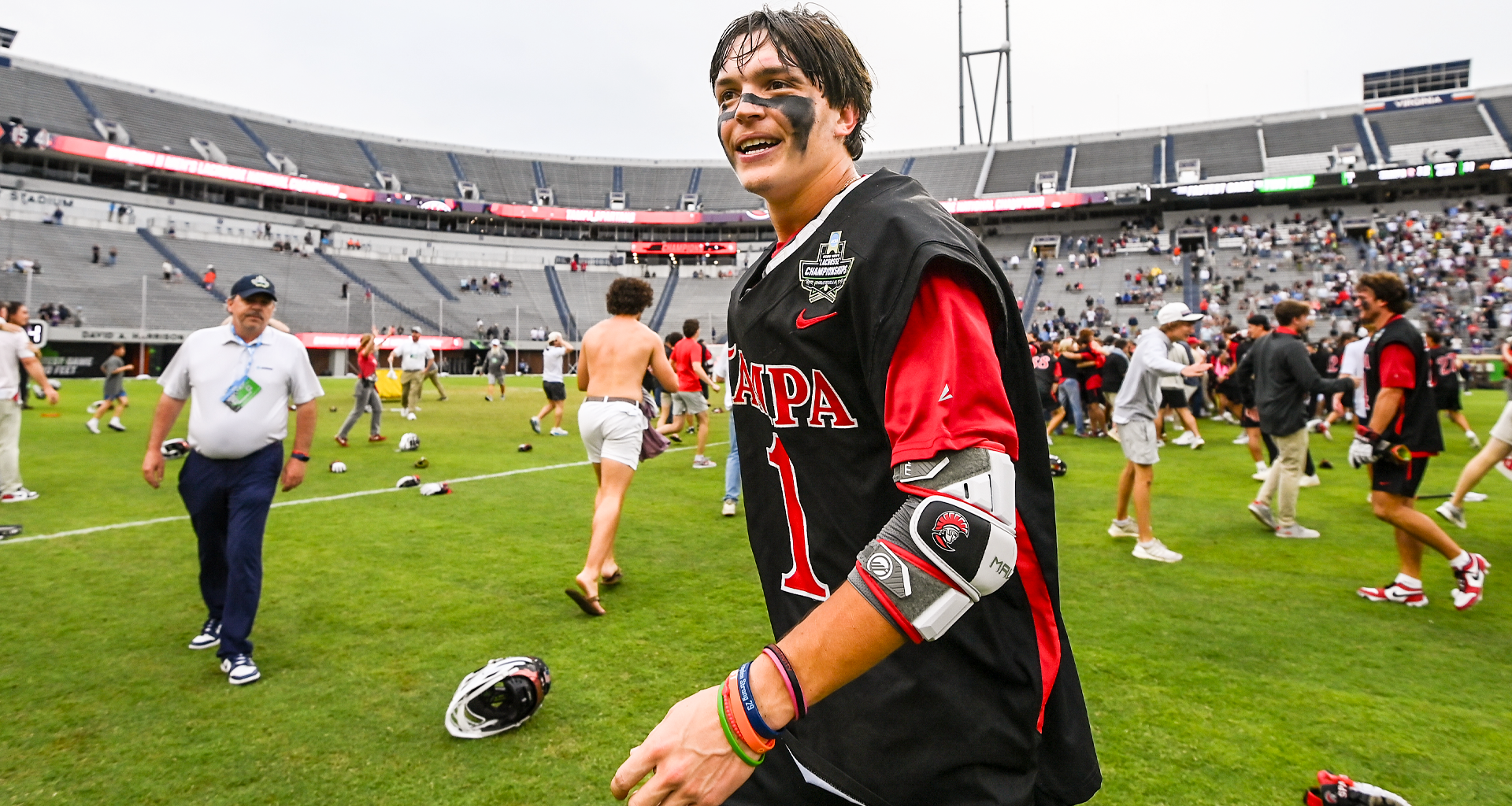 OT hero Tommy Ortega basks in the post-game celebration at Scott Stadium after Tampa's victory over Adelphi in the NCAA DIvision II championship game in Charlottesville, Va.