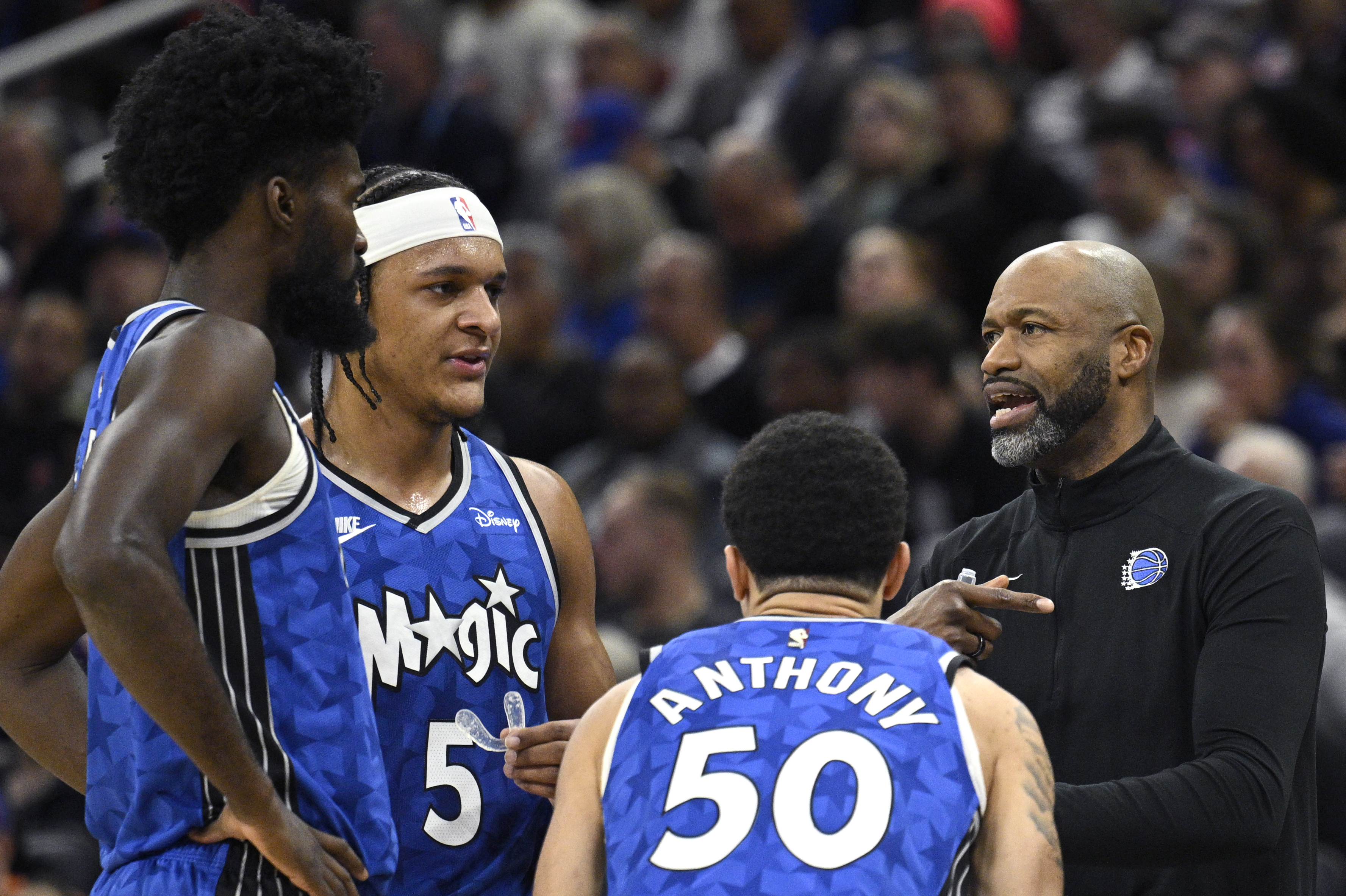Orlando Magic coach Jamahl Mosley, right, talks with forward Jonathan...