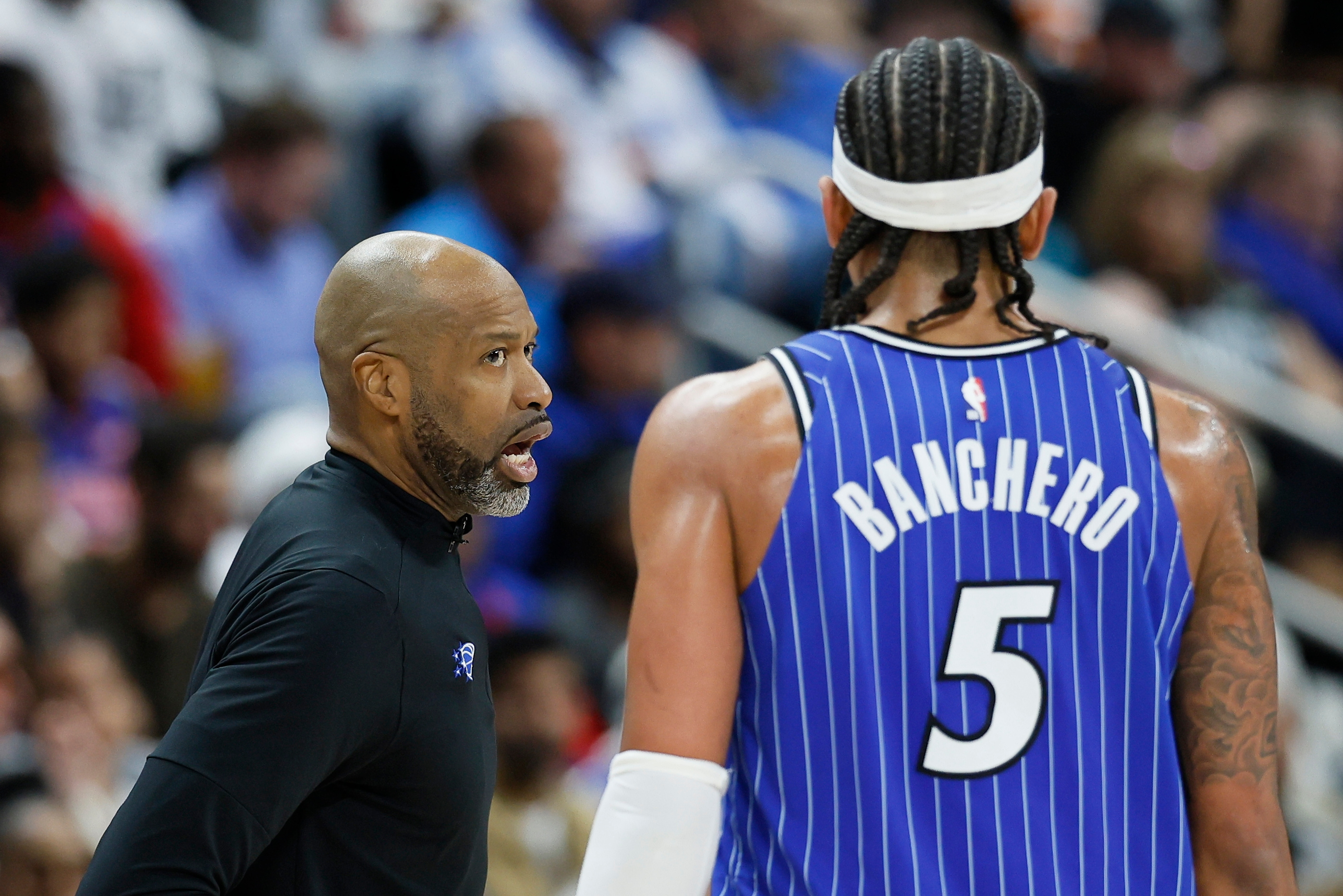 Orlando Magic head coach Jamahl Mosley talks with forward Paolo...