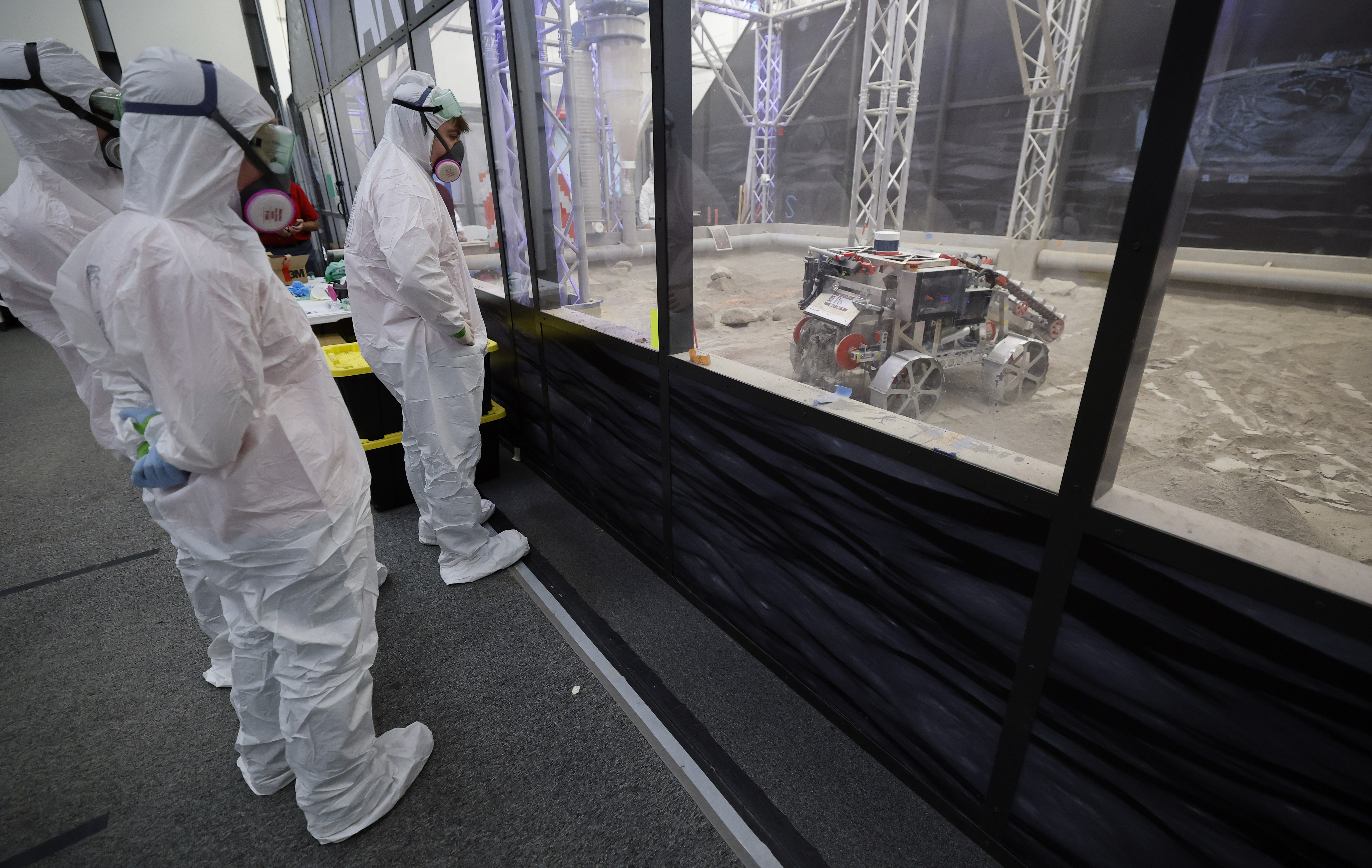 University of Alabama team members watch their robot make a...