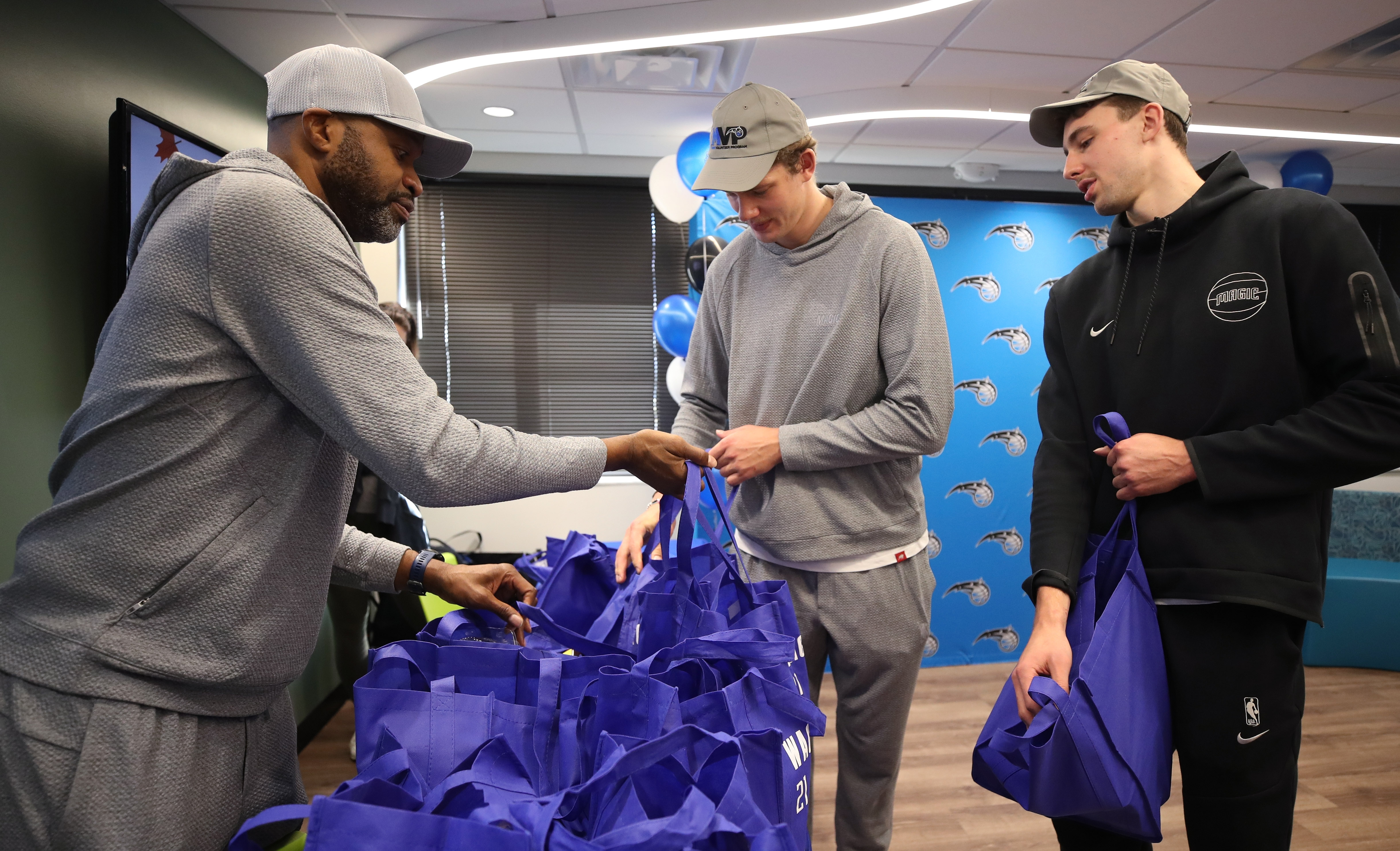 From left, Orlando Magic head coach Jamahl Mosley, with Moe...