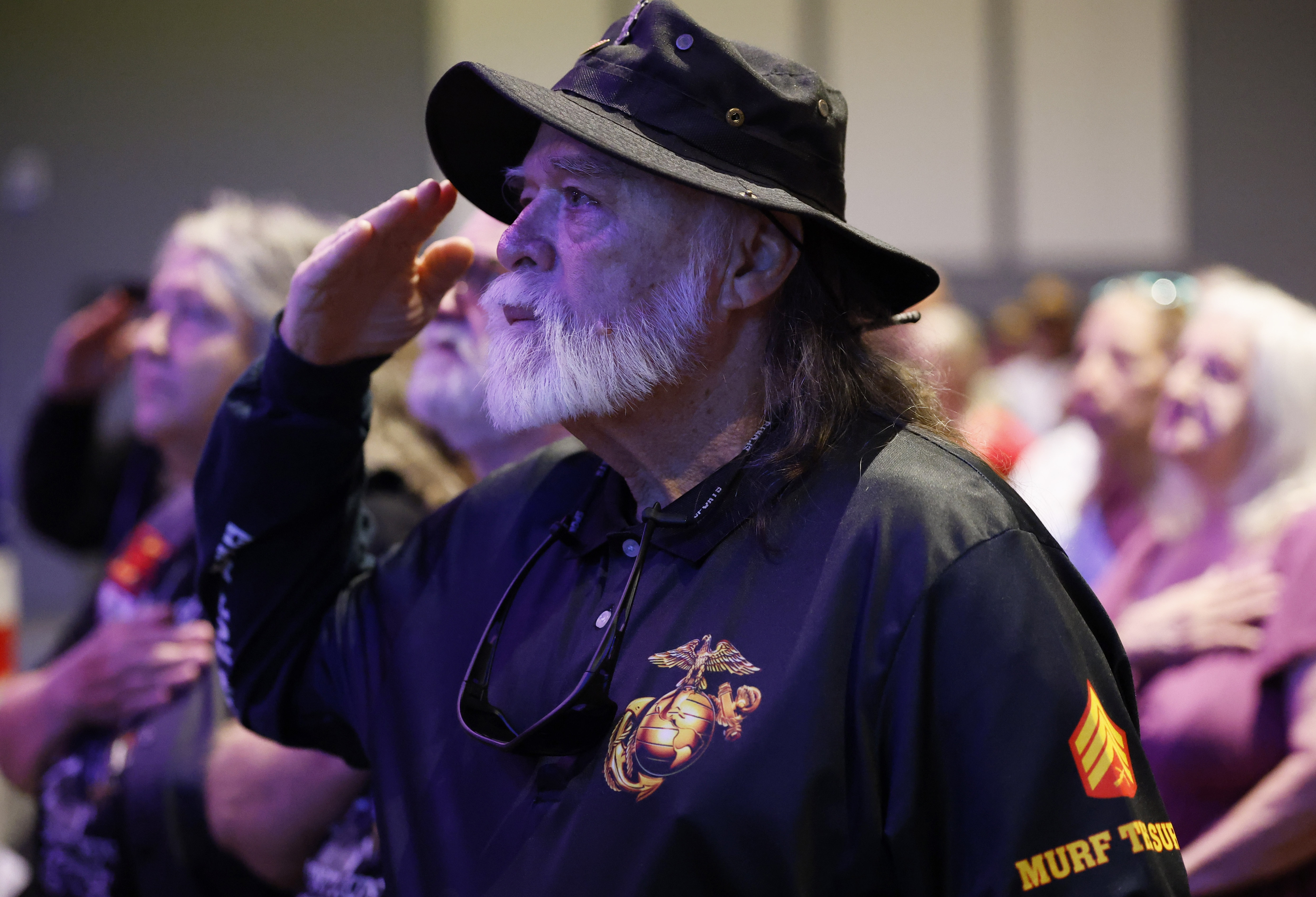 USMC veteran William Murphy salutes during the Memorial Day Ceremony...