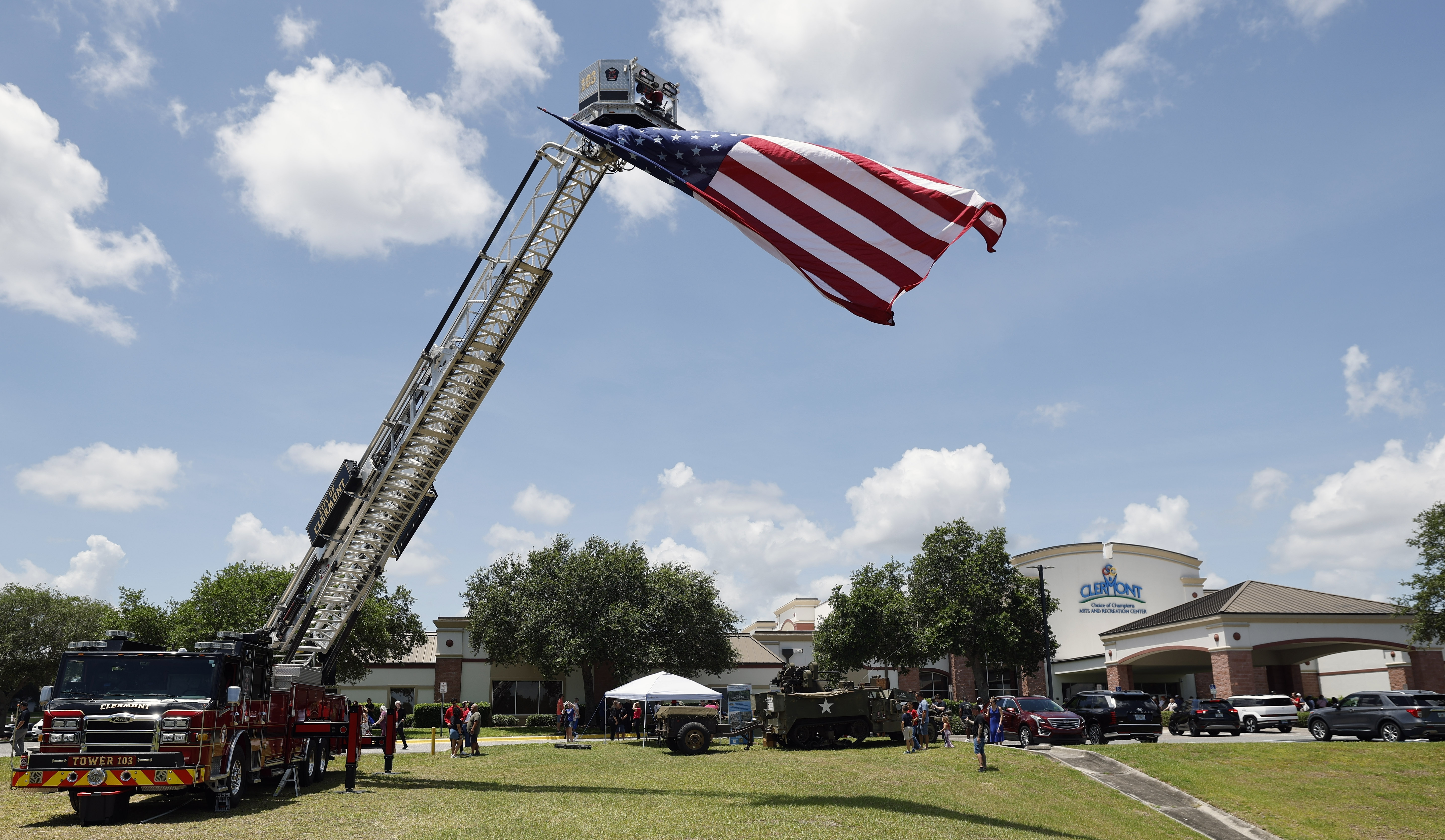 Clermont Fire Department Tower 103 displays the US Flag during...