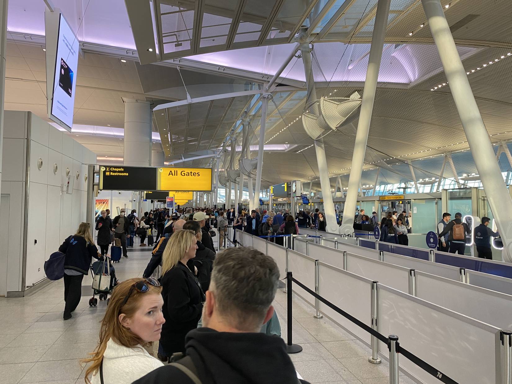 Travelers in line at TSA Precheck at John F Kennedy Airport in Queens, New York, USA