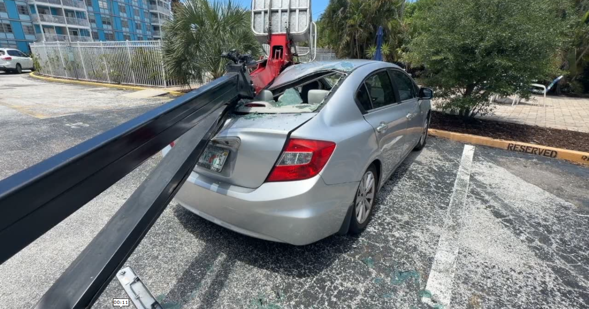 Car crushed in St. Petersburg after cherry picker lands on top