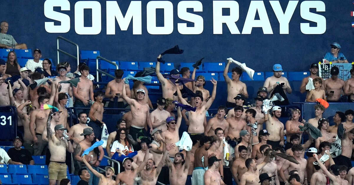 Shirtless fans cheer at MLB stadiums as "Tarps Off" trend sweeps baseball world
